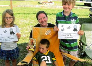 Crawdad race winners are, from left, Gemma Moore (3rd), Briggham Belunes and his mother (1st) and Gage Bierman (2nd). Submitted photo.