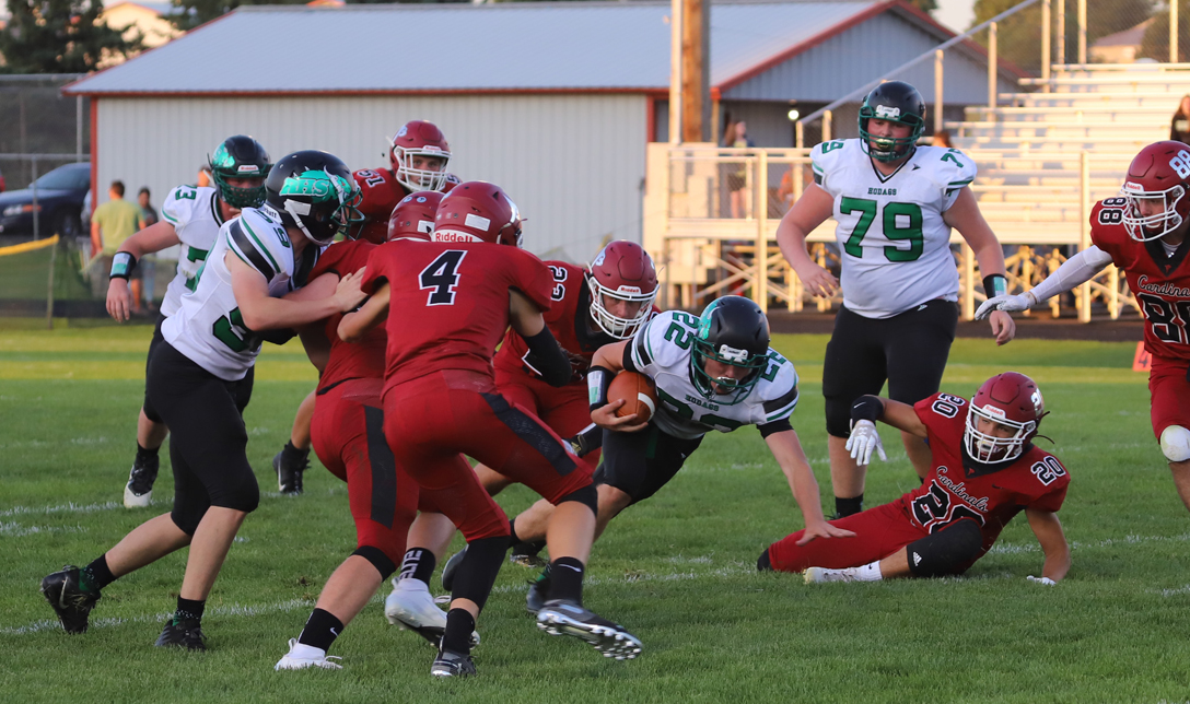 Peyton Erikson falls forward for a gain in the Prescott end of the field.