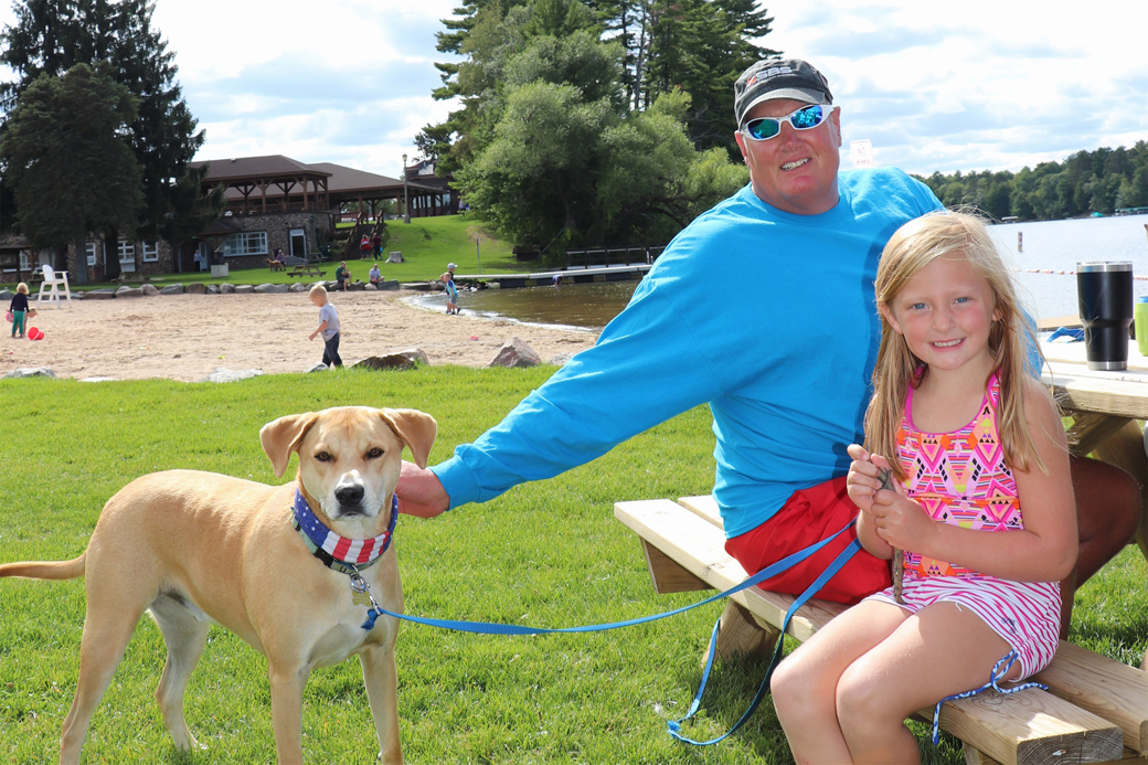 Rich, Charlotte and Buddy enjoy the sunny afternoon at the lake.
