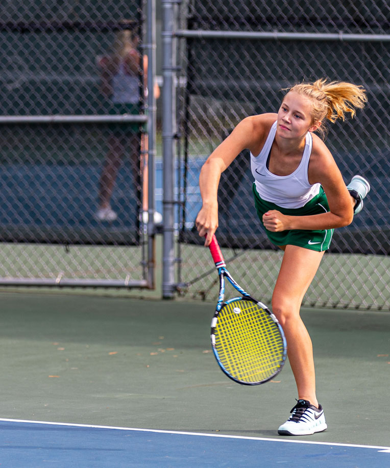No.1 singles player Annika Johnson serves to Lakeland.