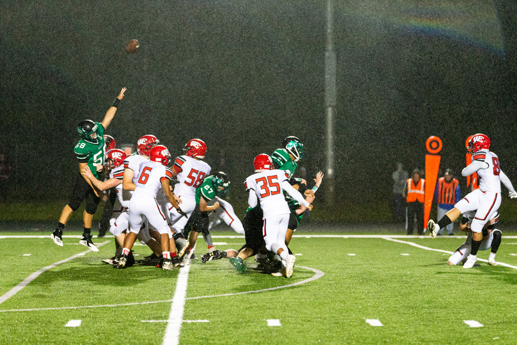No. 58 Ben Sinclair tries to block the extra point.