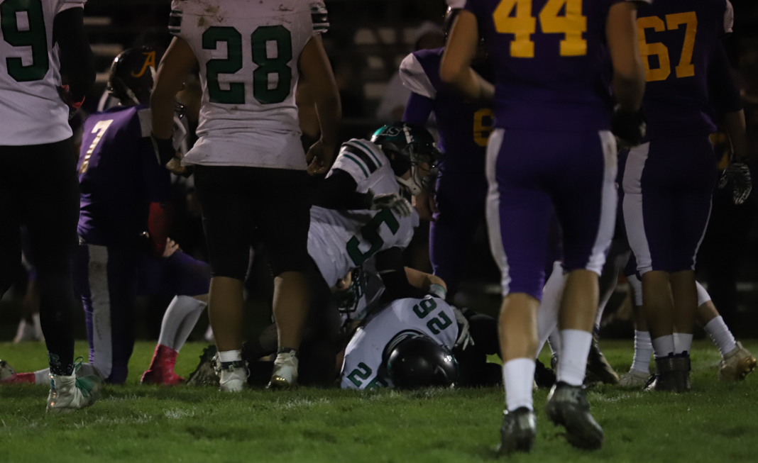 Caleb Olcikas cradles the ball after the on-side kick by Ashland.