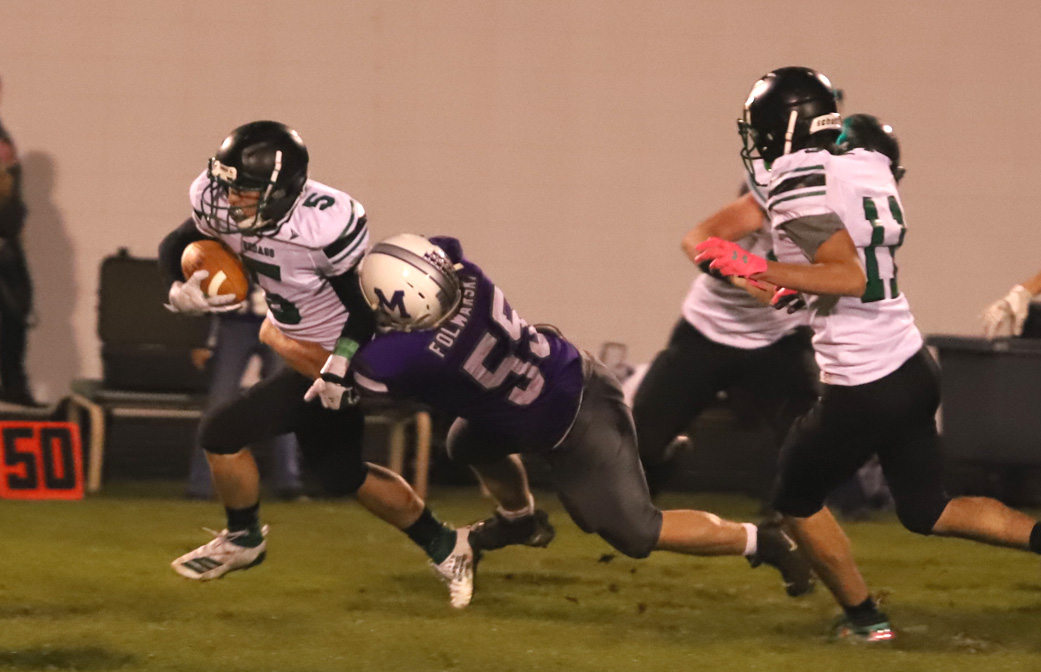 Max Spaulding is tackled after his first interception of the night.