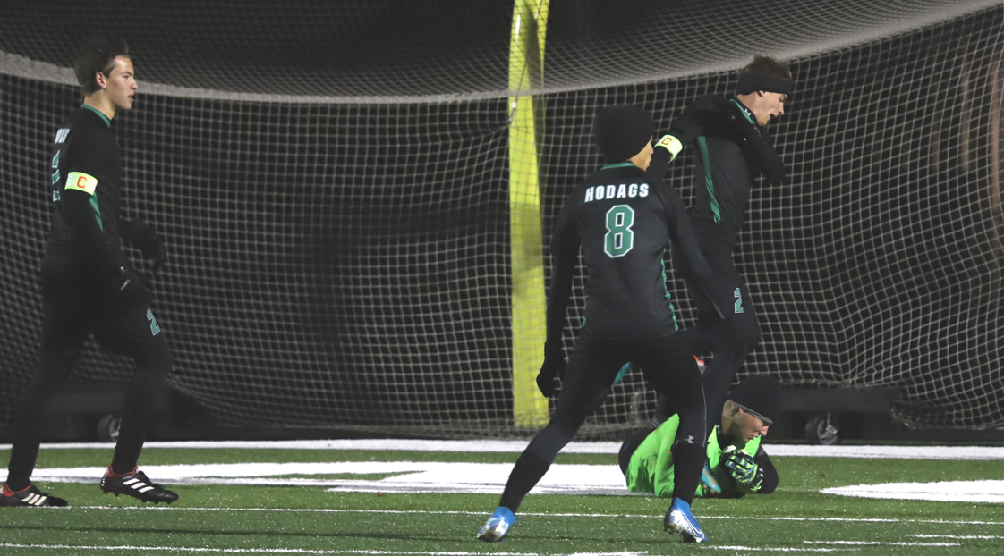 Keeper Gavin Ostermann covers the ball in front of the net.