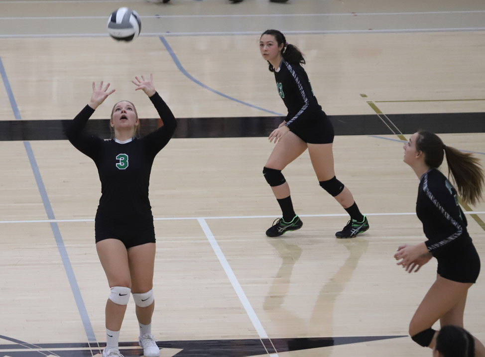 Olivia TerBeest sets the ball for a kill attempt.