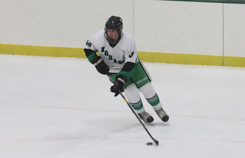 Harlan Wojtusik skates the puck out of the defensive zone.