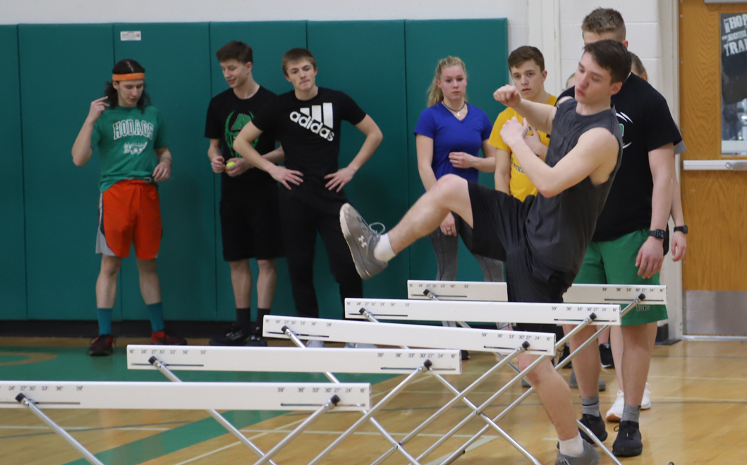 Nick Kriesel leads the hurdlers in a workout drill.