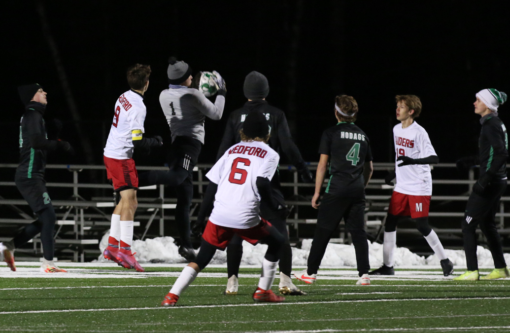 Medford has a ball picked clean by keeper Gavin Ostermann after a corner kick.