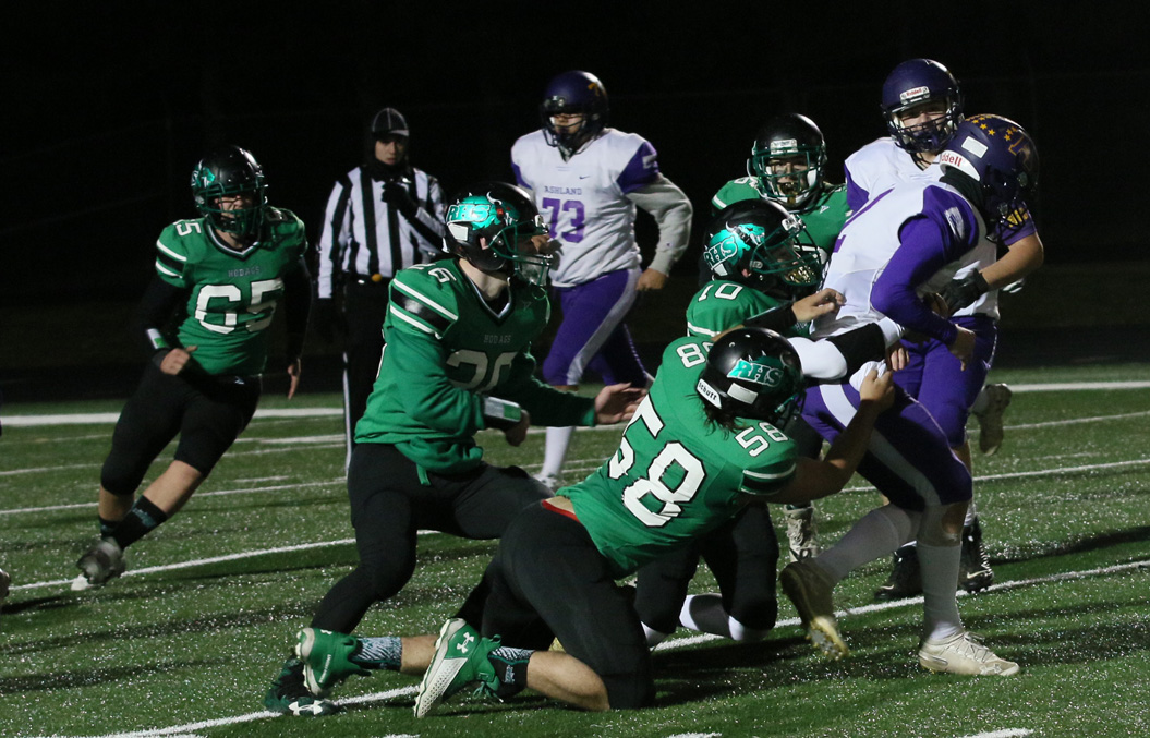 Ben Sinclair and Chad Hunt take down the Ashland ball carrier for a loss.