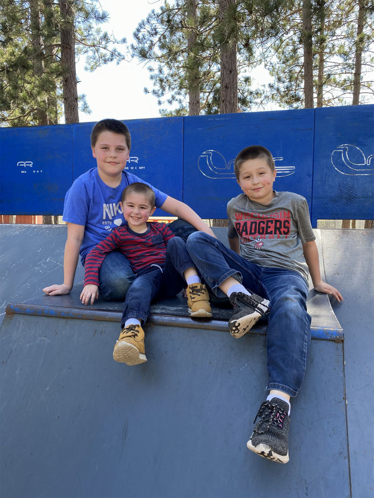 Chandler, Ryker and Brayden play at the Community Park in Boulder Junction.