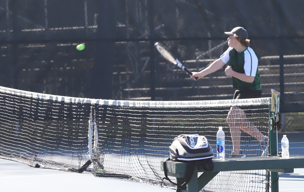 Layne Roeser slams the ball for a point in the No. 2 doubles match.