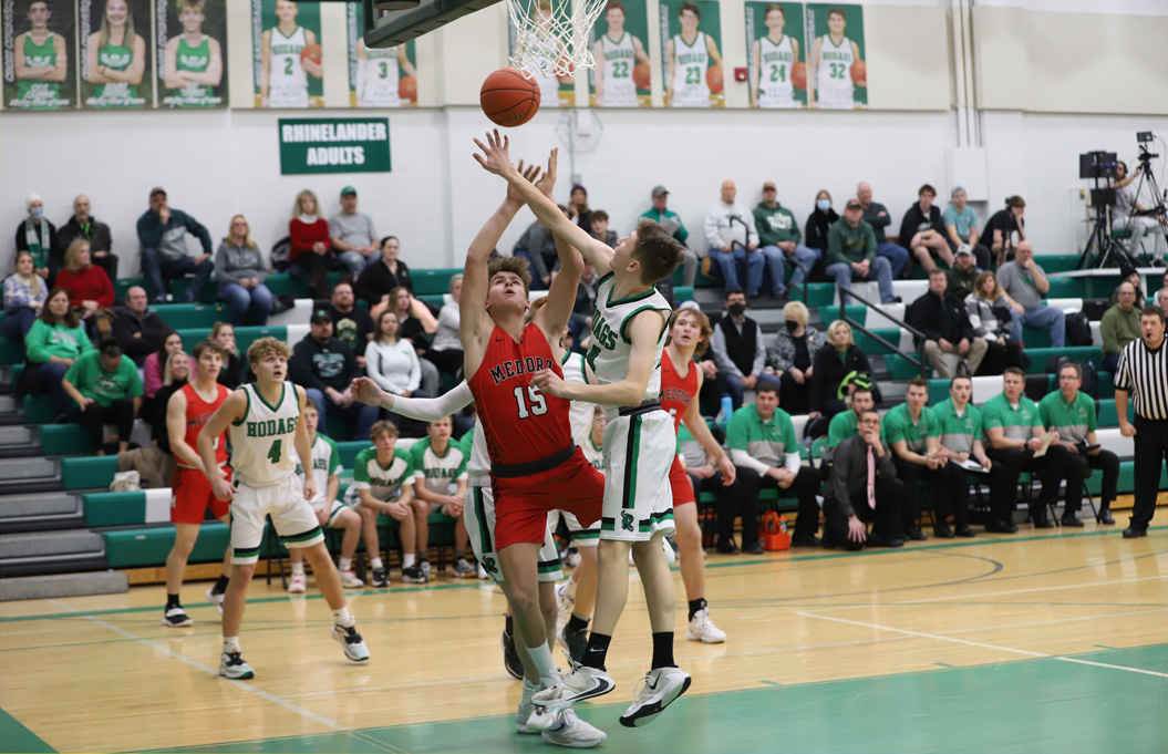 Ryan Jamison blocks a Medford shot early in the first half.