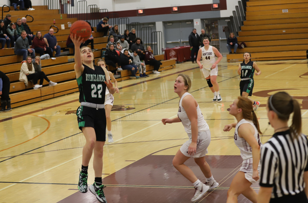 Lily Treder makes the breakaway layup for two of her 11 points.