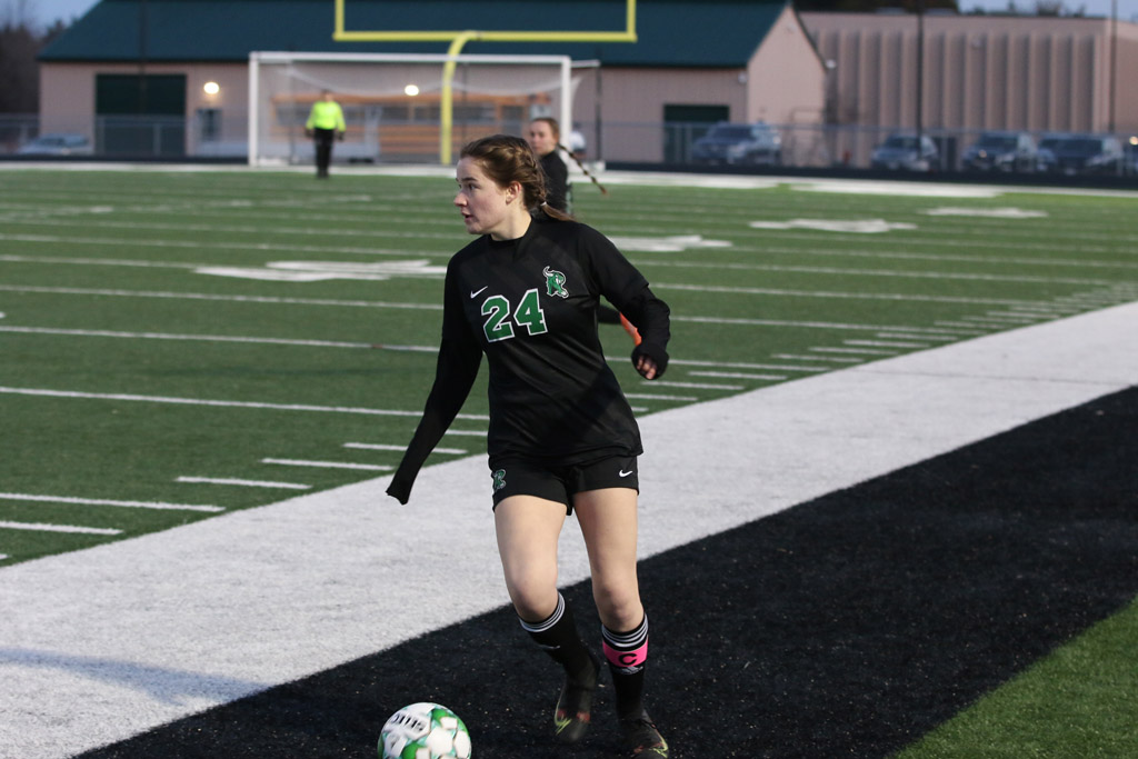 Aubrey Younker dribbles the sideline and looks for an open teammate.