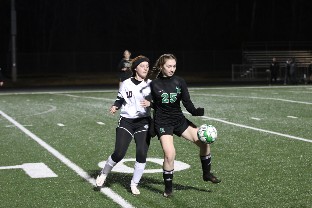 Kinzie Arneson controls the ball in front of an Antigo defender.